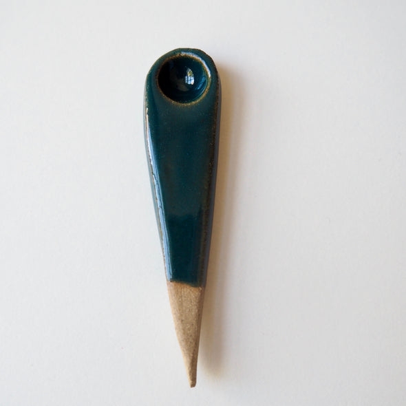 small teal ceramic spoon