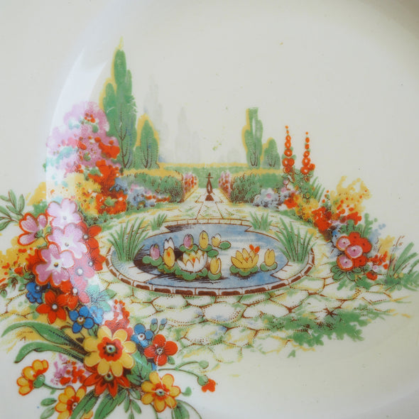 Vintage pottery floral cottage garden side plates